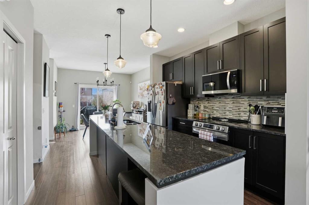 227 Copperpond Row Se, Calgary, AB - Indoor Photo Showing Kitchen With Upgraded Kitchen