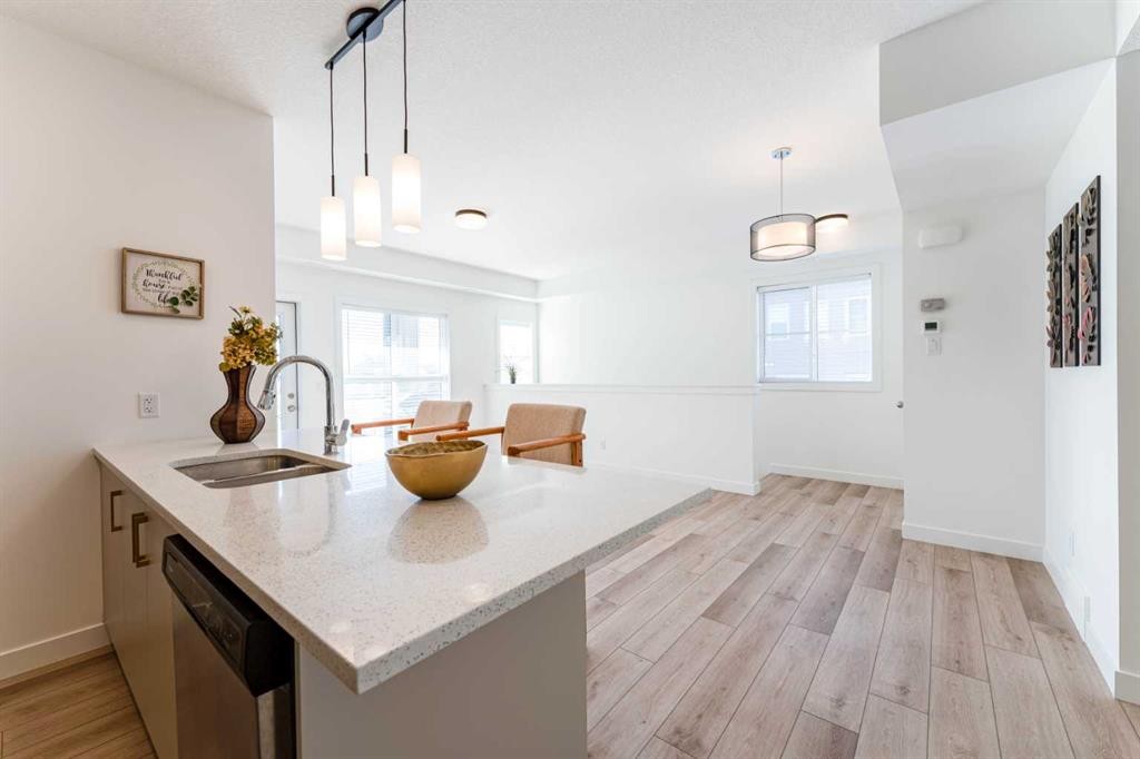 120 Spring Creek Common Sw, Calgary, AB - Indoor Photo Showing Kitchen With Double Sink
