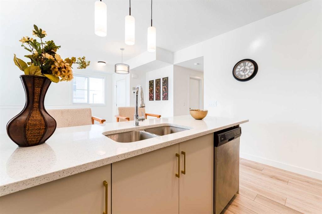 120 Spring Creek Common Sw, Calgary, AB - Indoor Photo Showing Kitchen With Double Sink