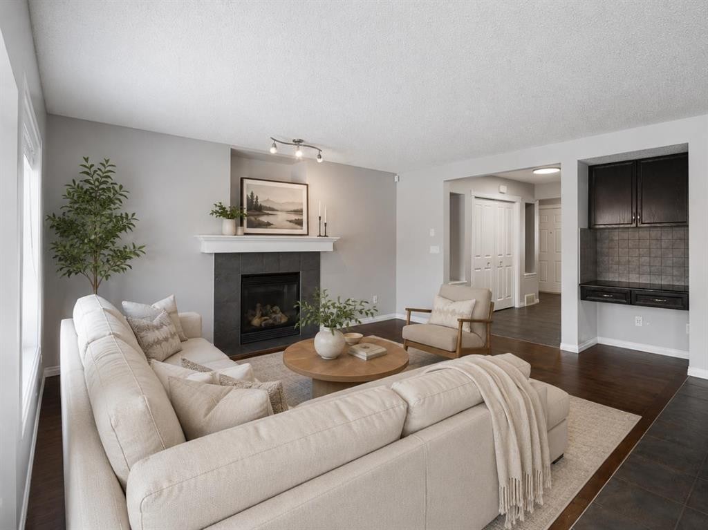 72 Pantego Close Nw, Calgary, AB - Indoor Photo Showing Living Room With Fireplace