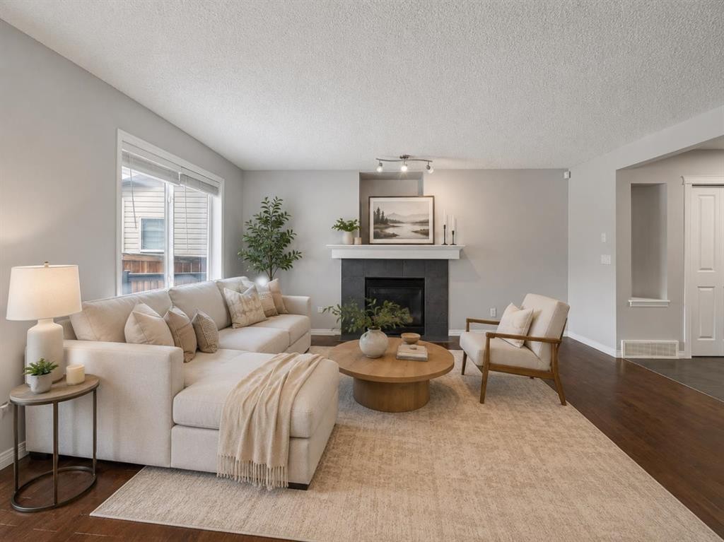 72 Pantego Close Nw, Calgary, AB - Indoor Photo Showing Living Room With Fireplace