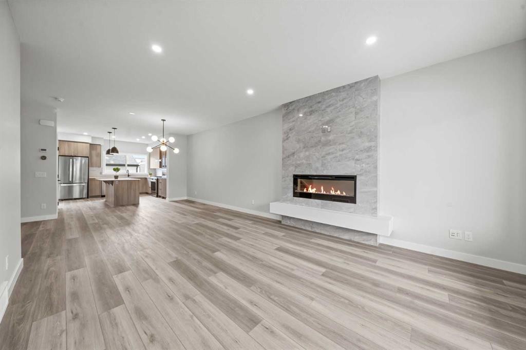 46 Versant View Sw, Calgary, AB - Indoor Photo Showing Living Room With Fireplace