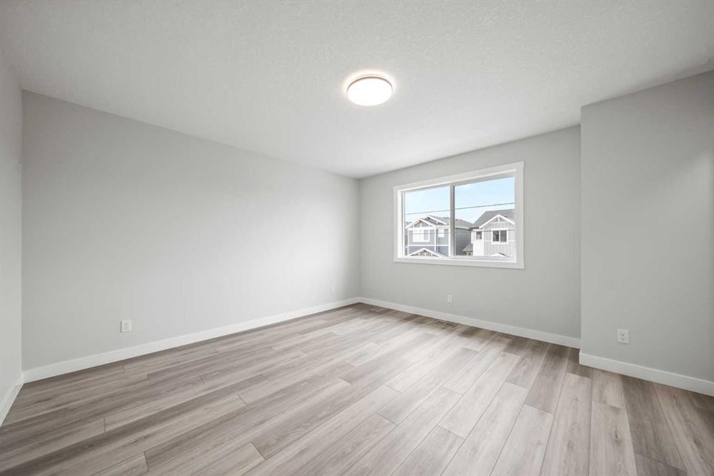 46 Versant View Sw, Calgary, AB - Indoor Photo Showing Other Room