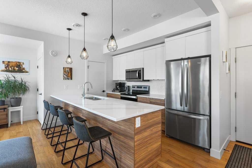 222 Seton Passage Se, Calgary, AB - Indoor Photo Showing Kitchen With Double Sink With Upgraded Kitchen