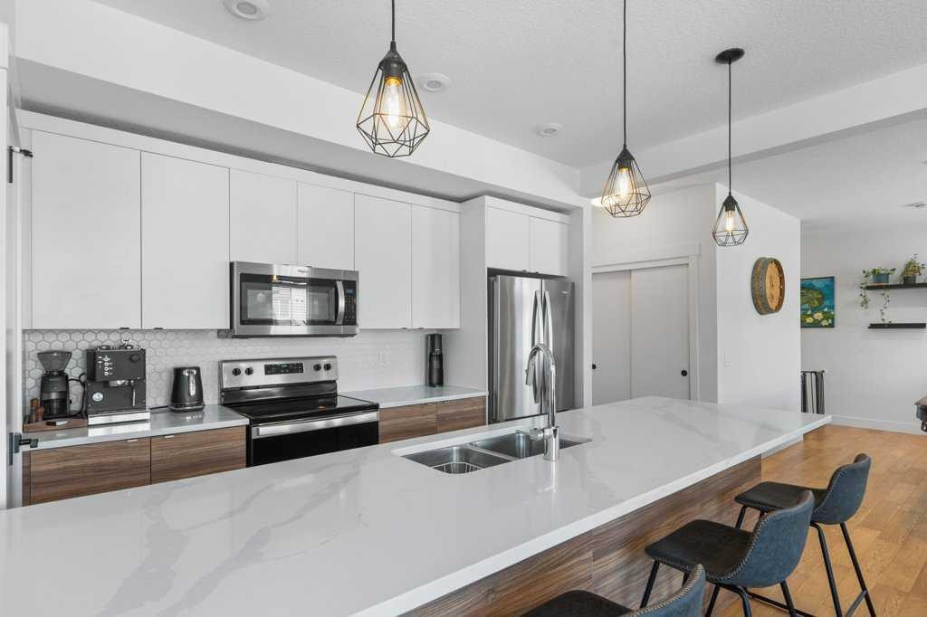222 Seton Passage Se, Calgary, AB - Indoor Photo Showing Kitchen With Double Sink With Upgraded Kitchen