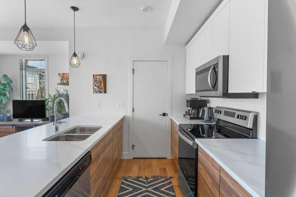 222 Seton Passage Se, Calgary, AB - Indoor Photo Showing Kitchen With Double Sink