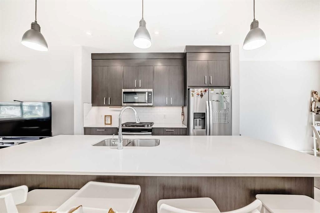 120 Chelsea Drive, Chestermere, AB - Indoor Photo Showing Kitchen With Double Sink With Upgraded Kitchen