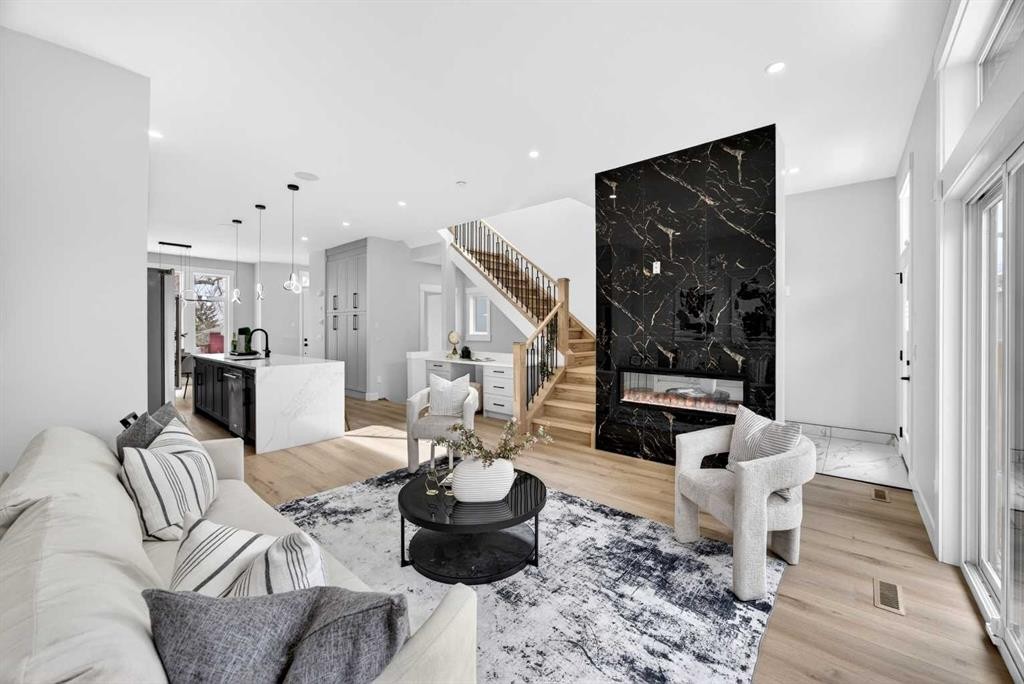 107 Hartford Road Nw, Calgary, AB - Indoor Photo Showing Living Room With Fireplace