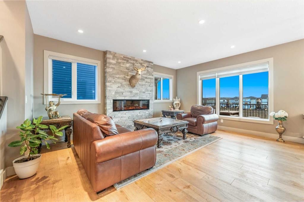 105 Carringvue Manor Nw, Calgary, AB - Indoor Photo Showing Living Room With Fireplace