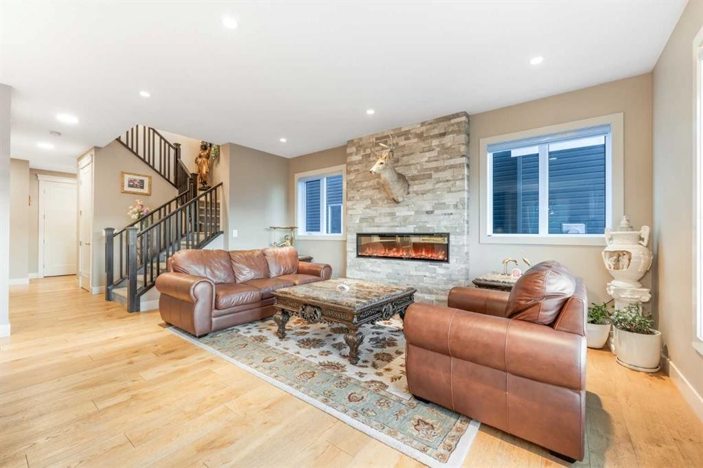 105 Carringvue Manor Nw, Calgary, AB - Indoor Photo Showing Living Room With Fireplace