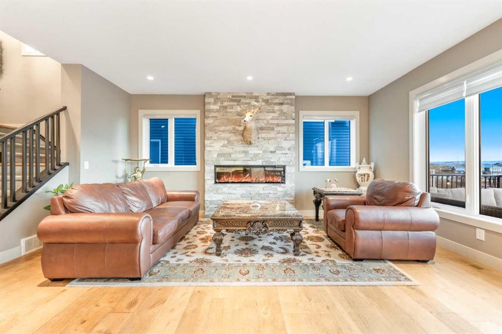 105 Carringvue Manor Nw, Calgary, AB - Indoor Photo Showing Living Room With Fireplace