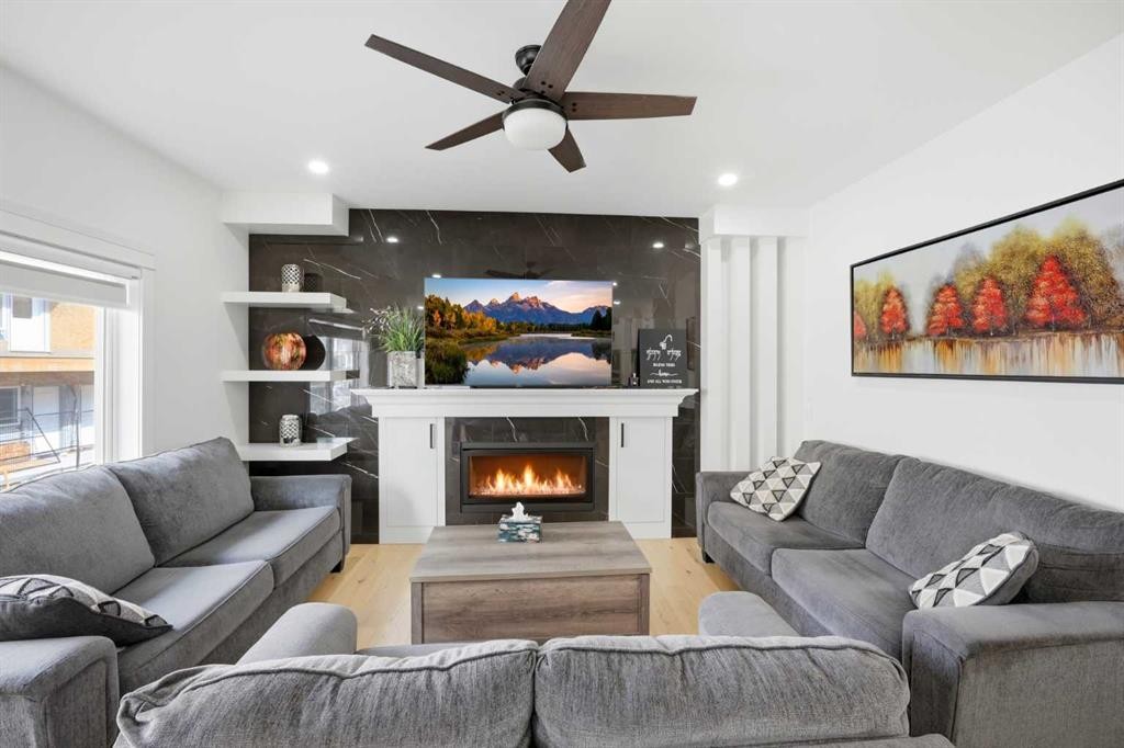 15 Saddlecrest Link Ne, Calgary, AB - Indoor Photo Showing Living Room With Fireplace