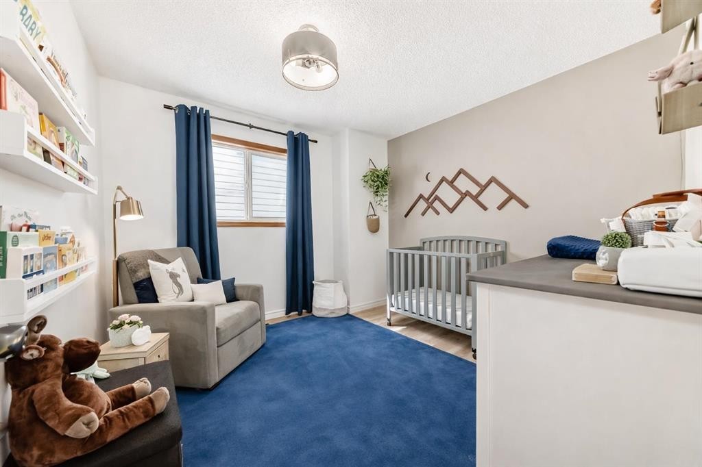 110 Erin Meadow Close Se, Calgary, AB - Indoor Photo Showing Bedroom