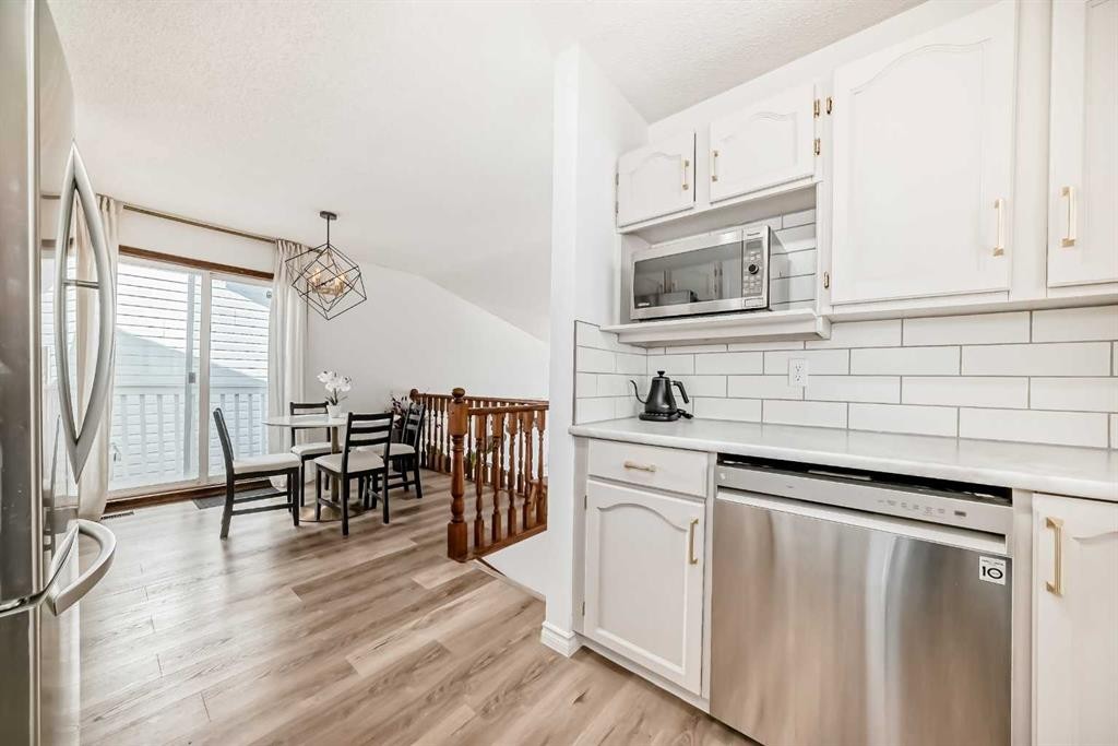 110 Erin Meadow Close Se, Calgary, AB - Indoor Photo Showing Kitchen