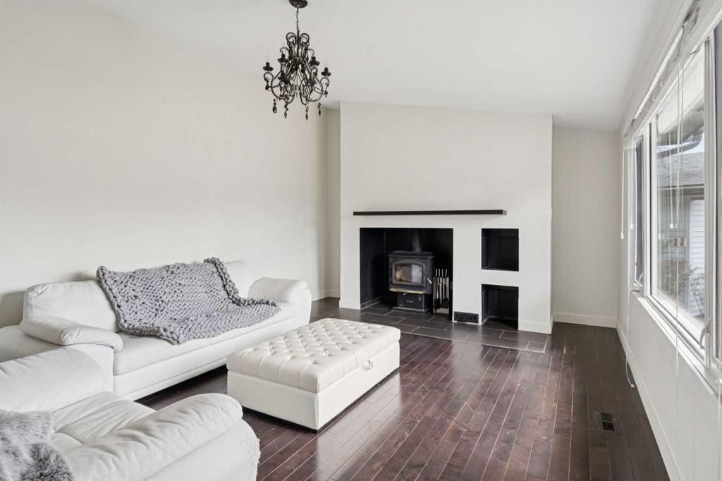 214 Springwood Place Sw, Calgary, AB - Indoor Photo Showing Living Room With Fireplace