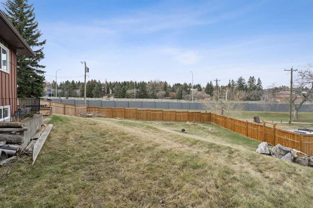 214 Springwood Place Sw, Calgary, AB - Outdoor With Backyard