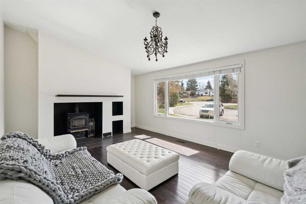 214 Springwood Place Sw, Calgary, AB - Indoor Photo Showing Living Room With Fireplace