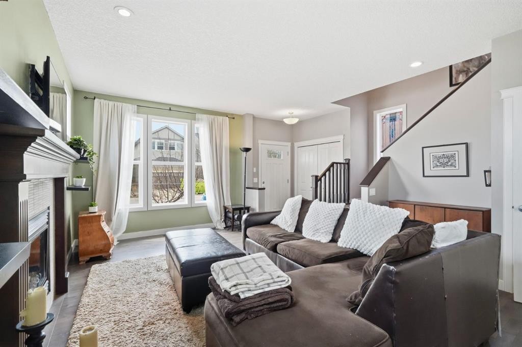 42 Sage Hill Green Nw, Calgary, AB - Indoor Photo Showing Living Room With Fireplace