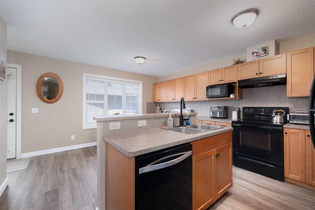 2524 Eversyde Avenue Sw, Calgary, AB - Indoor Photo Showing Kitchen With Double Sink