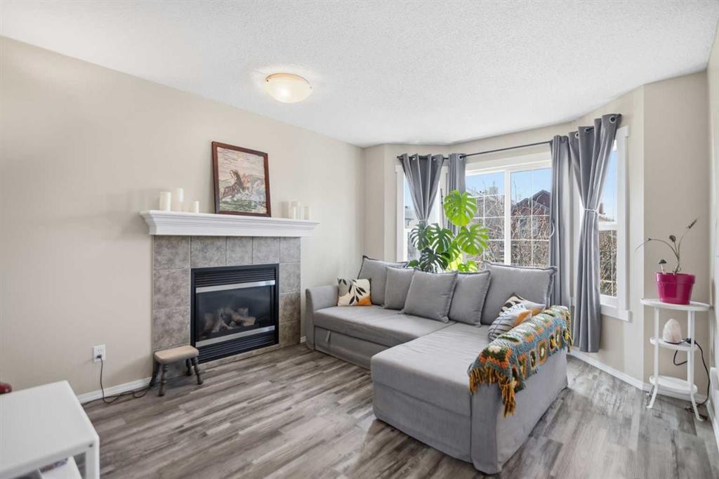 46 Saddlemont Way Ne, Calgary, AB - Indoor Photo Showing Living Room With Fireplace