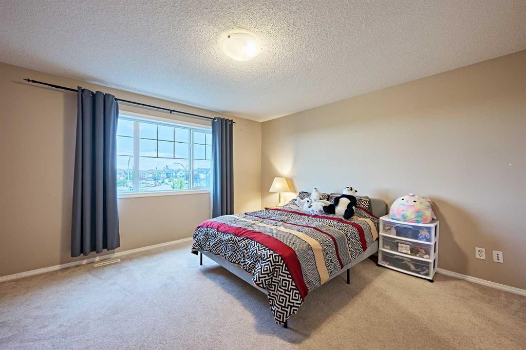 789 Panatella Boulevard Nw, Calgary, AB - Indoor Photo Showing Bedroom