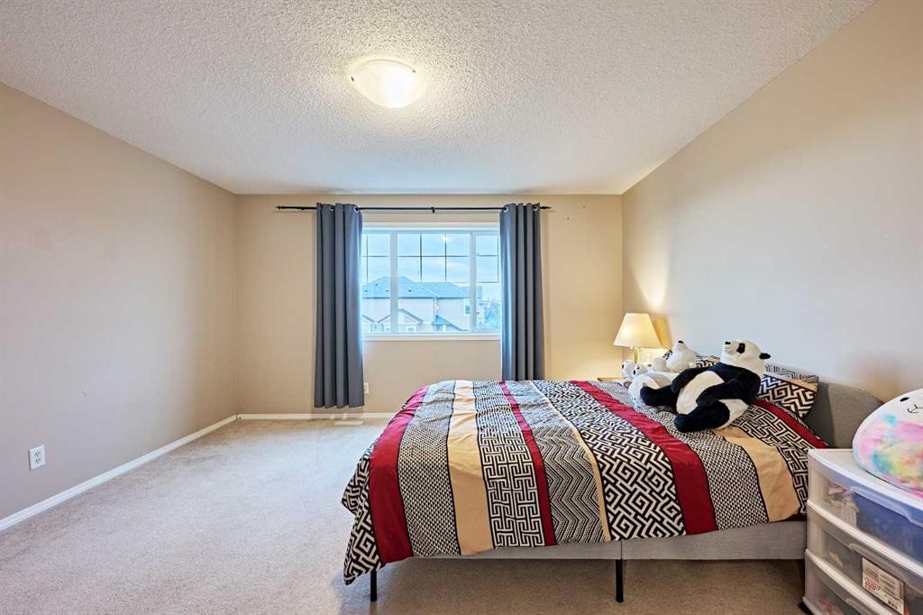 789 Panatella Boulevard Nw, Calgary, AB - Indoor Photo Showing Bedroom