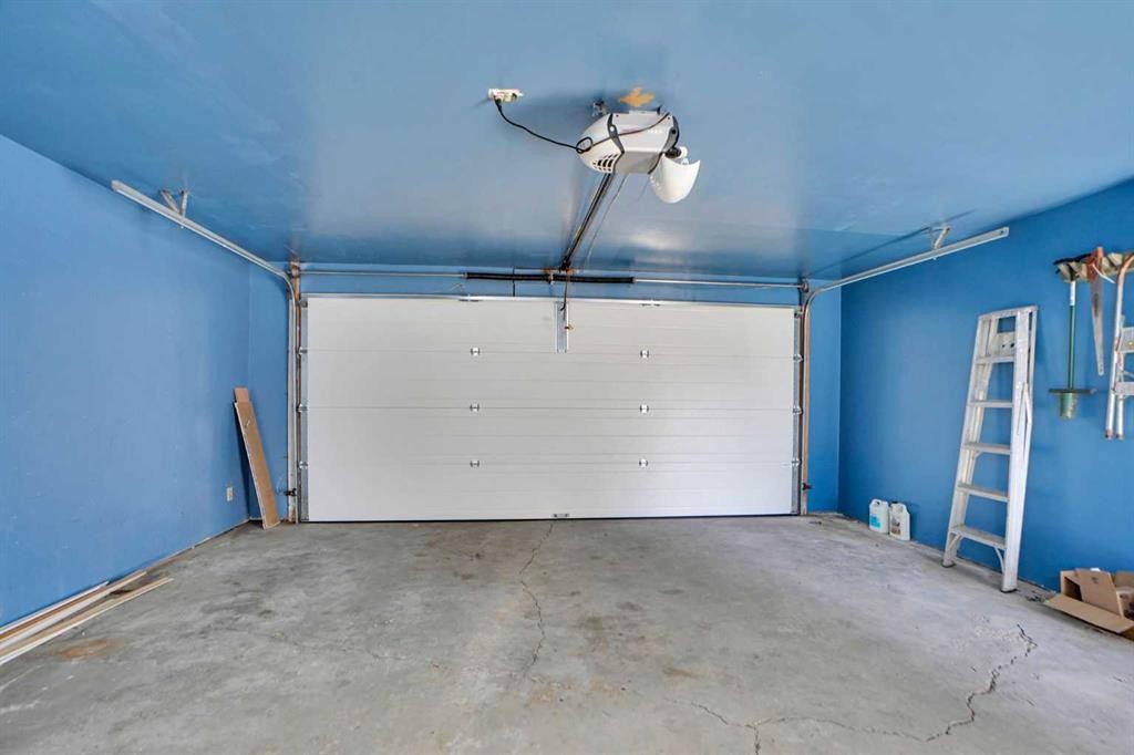 90 Martinridge Crescent Ne, Calgary, AB - Indoor Photo Showing Garage