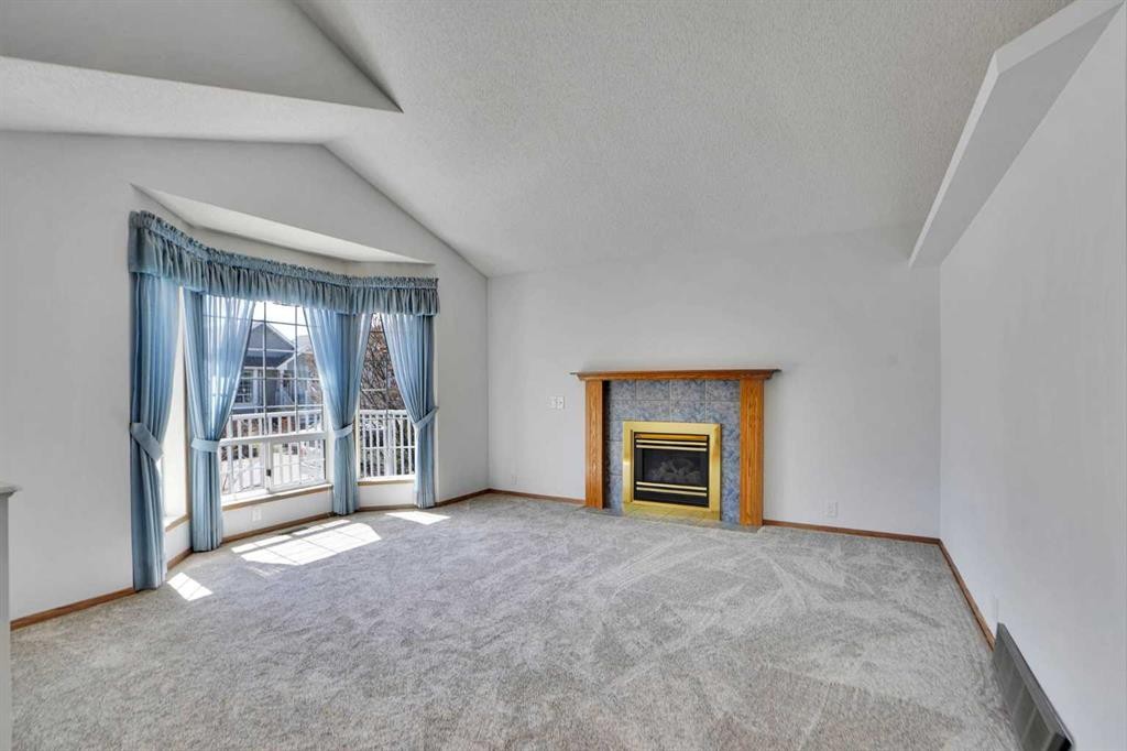 90 Martinridge Crescent Ne, Calgary, AB - Indoor Photo Showing Living Room With Fireplace