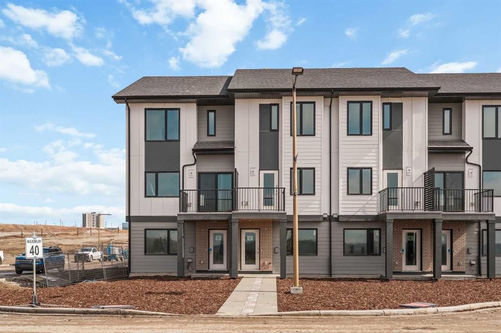 26 Rowmont Heath Nw, Calgary, AB - Outdoor With Balcony With Facade