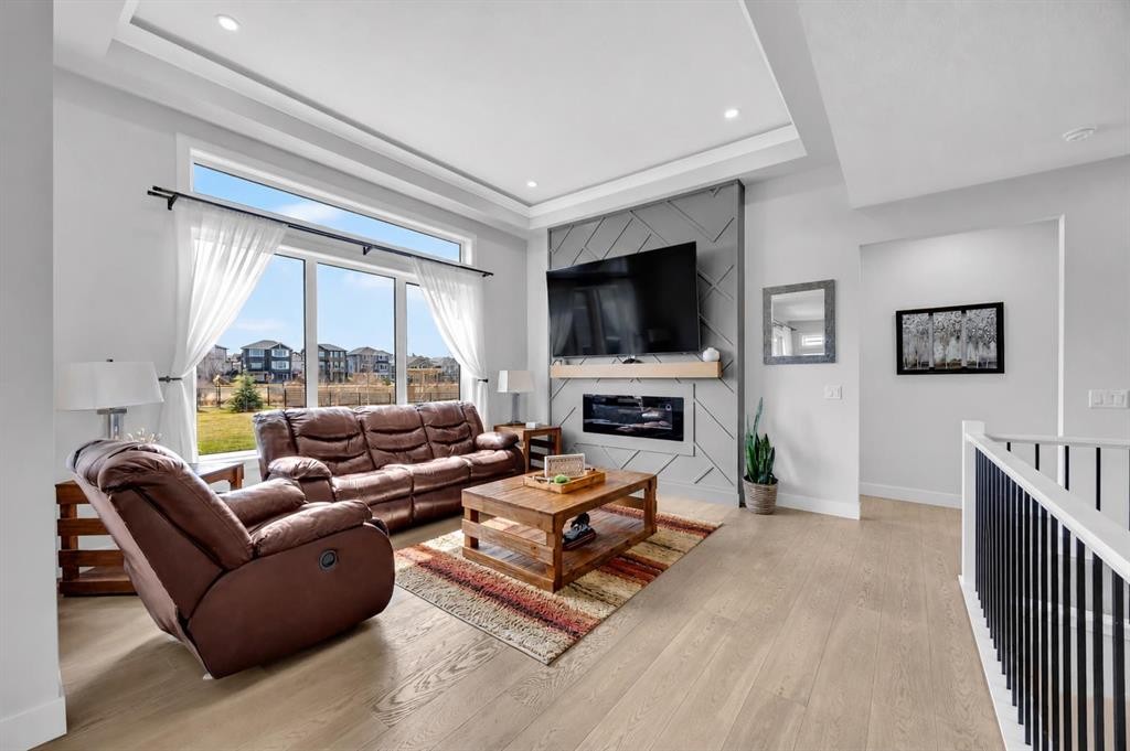 25 Cimarron Estates Gate, Okotoks, AB - Indoor Photo Showing Living Room With Fireplace