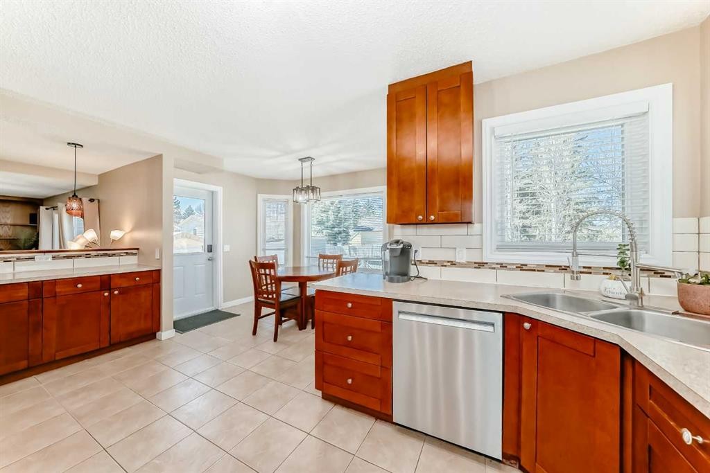 127 Mckerrell Way Se, Calgary, AB - Indoor Photo Showing Kitchen With Double Sink