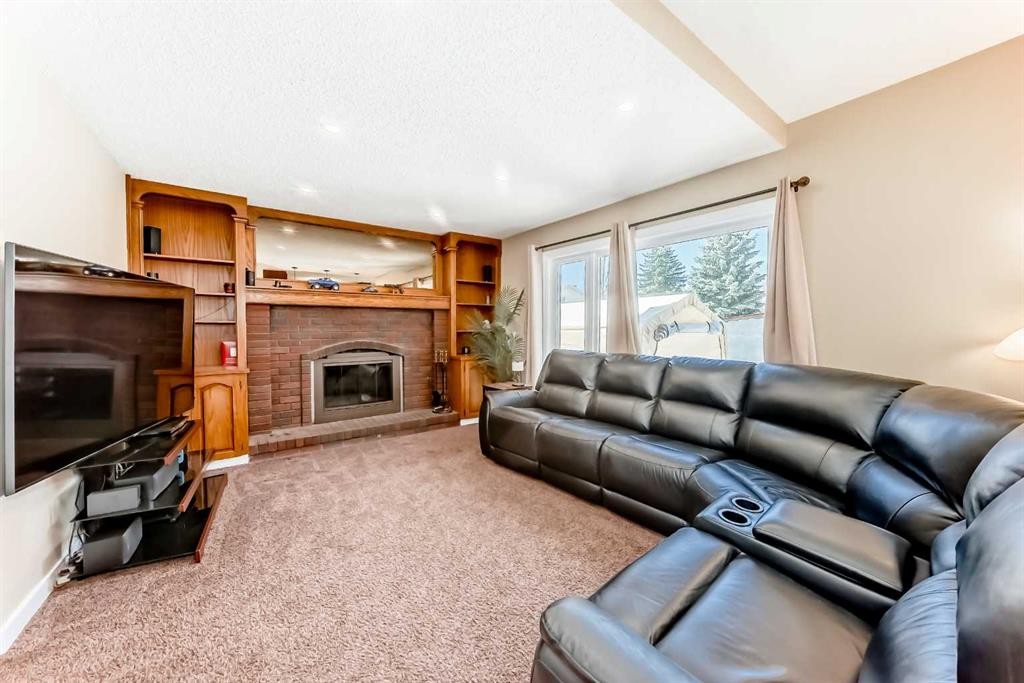 127 Mckerrell Way Se, Calgary, AB - Indoor Photo Showing Living Room With Fireplace