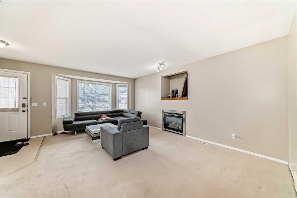 111 Tarawood Road Ne, Calgary, AB - Indoor Photo Showing Living Room With Fireplace