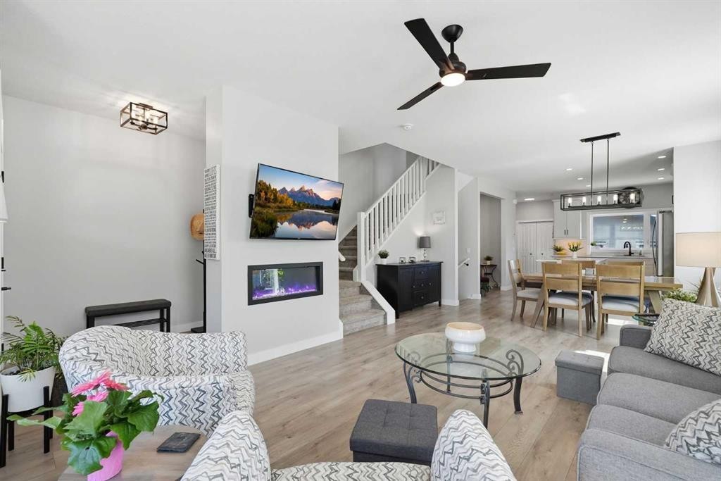 120 Treeline Manor Sw, Calgary, AB - Indoor Photo Showing Living Room With Fireplace