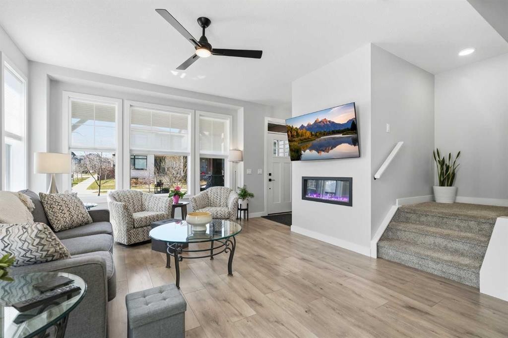 120 Treeline Manor Sw, Calgary, AB - Indoor Photo Showing Living Room With Fireplace