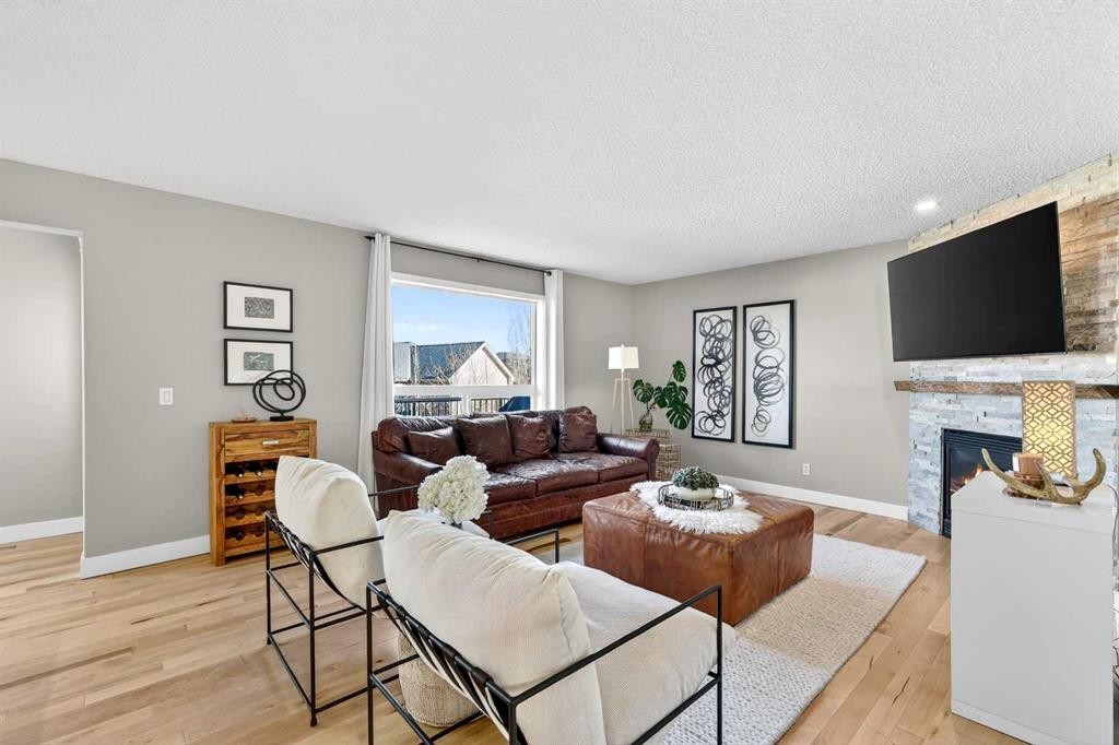 95 Crestmont Drive Sw, Calgary, AB - Indoor Photo Showing Living Room With Fireplace