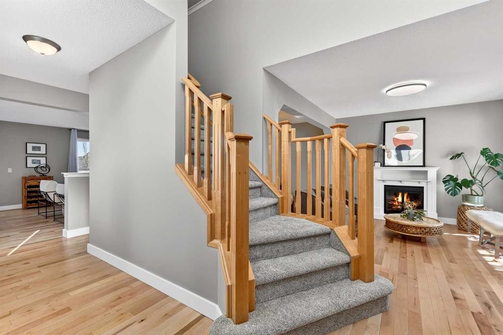 95 Crestmont Drive Sw, Calgary, AB - Indoor Photo Showing Other Room With Fireplace