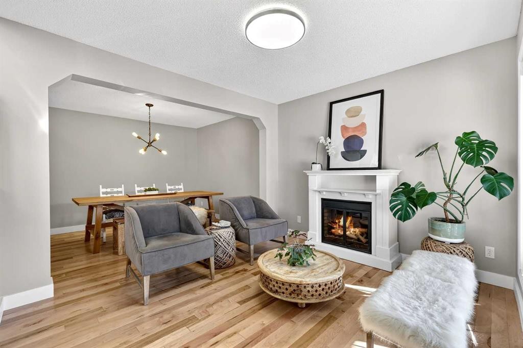 95 Crestmont Drive Sw, Calgary, AB - Indoor Photo Showing Living Room With Fireplace