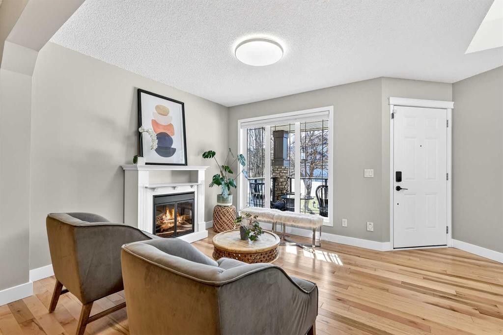 95 Crestmont Drive Sw, Calgary, AB - Indoor Photo Showing Living Room With Fireplace