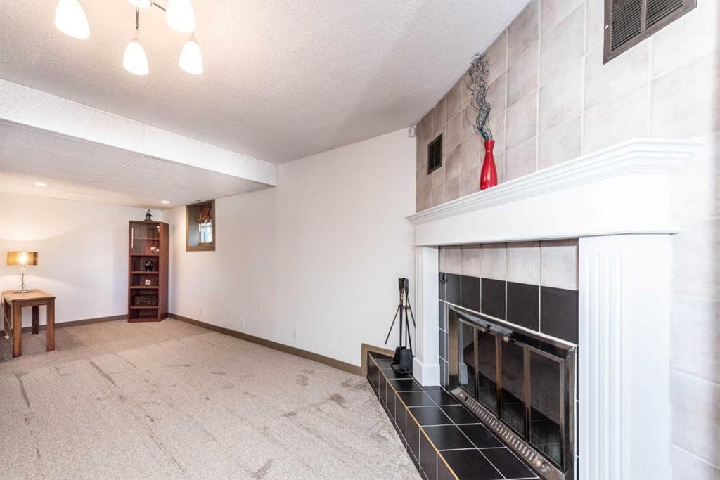 16 Rundleson Way Ne, Calgary, AB - Indoor With Fireplace