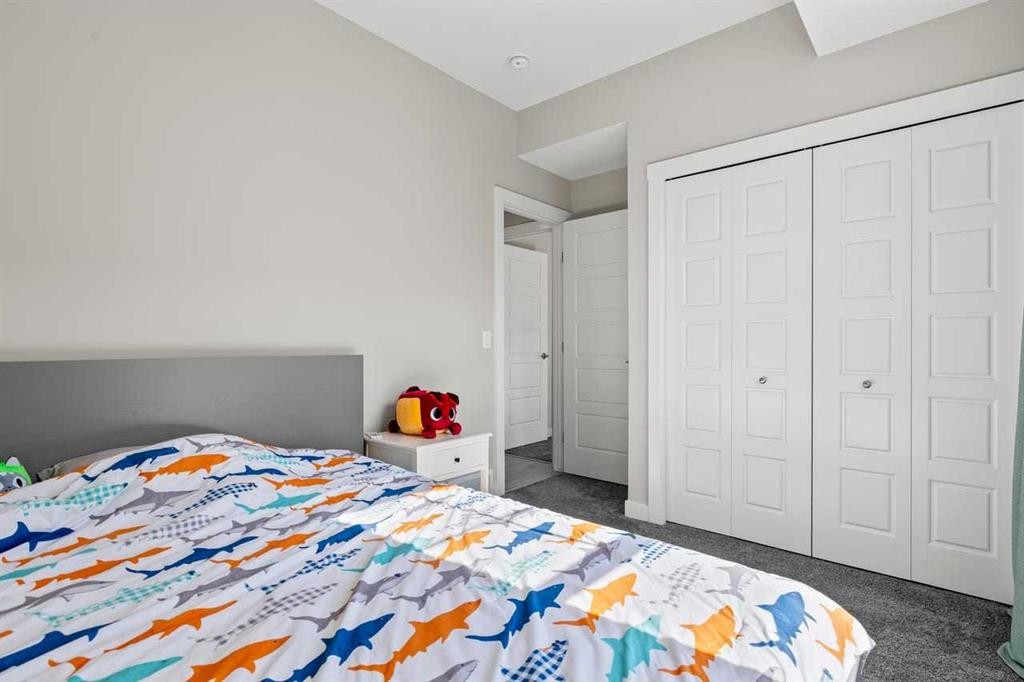 306 Cranbrook Walk Se, Calgary, AB - Indoor Photo Showing Bedroom