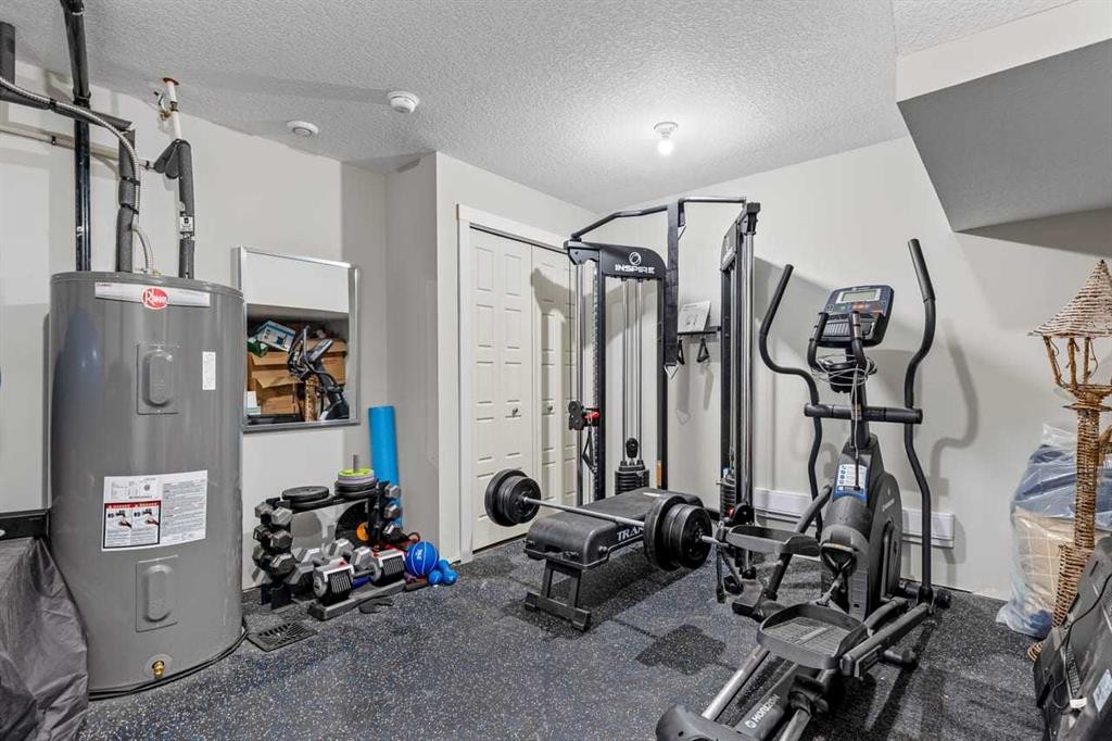 306 Cranbrook Walk Se, Calgary, AB - Indoor Photo Showing Gym Room