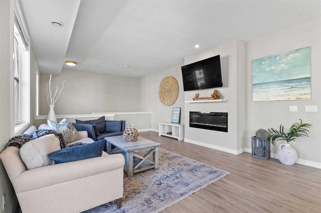 306 Cranbrook Walk Se, Calgary, AB - Indoor Photo Showing Living Room With Fireplace