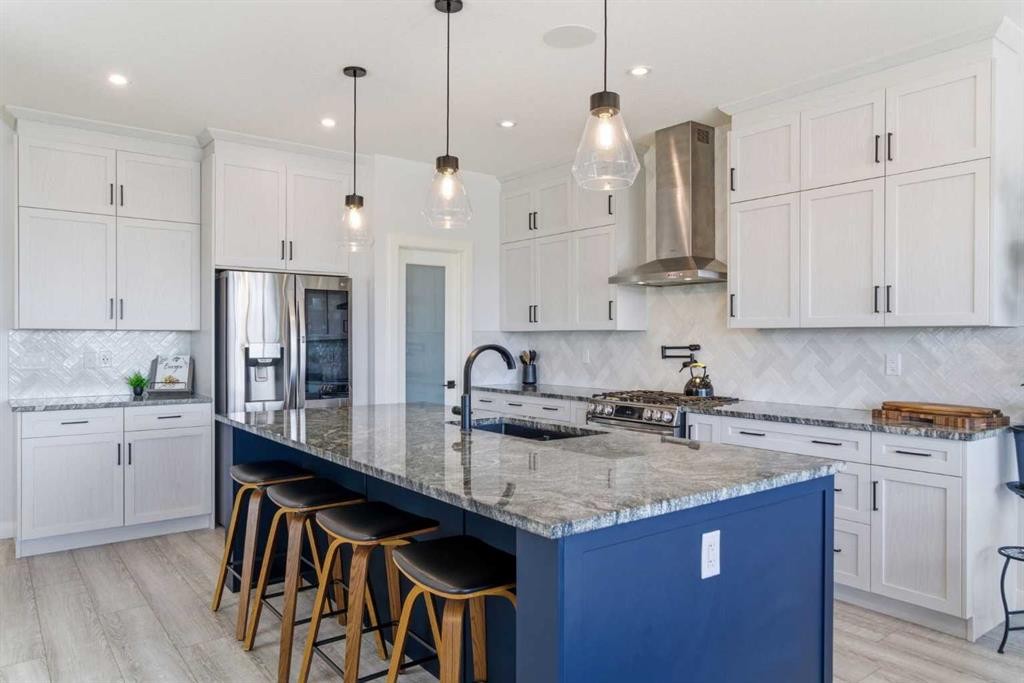 303 Rivercrest Boulevard, Cochrane, AB - Indoor Photo Showing Kitchen With Stainless Steel Kitchen With Upgraded Kitchen