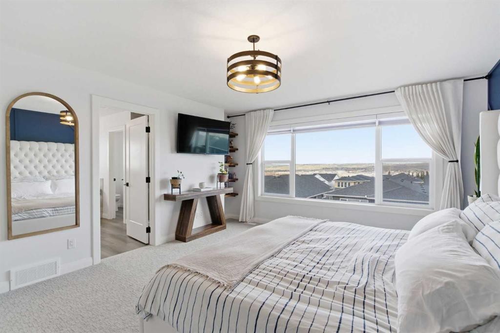 303 Rivercrest Boulevard, Cochrane, AB - Indoor Photo Showing Bedroom