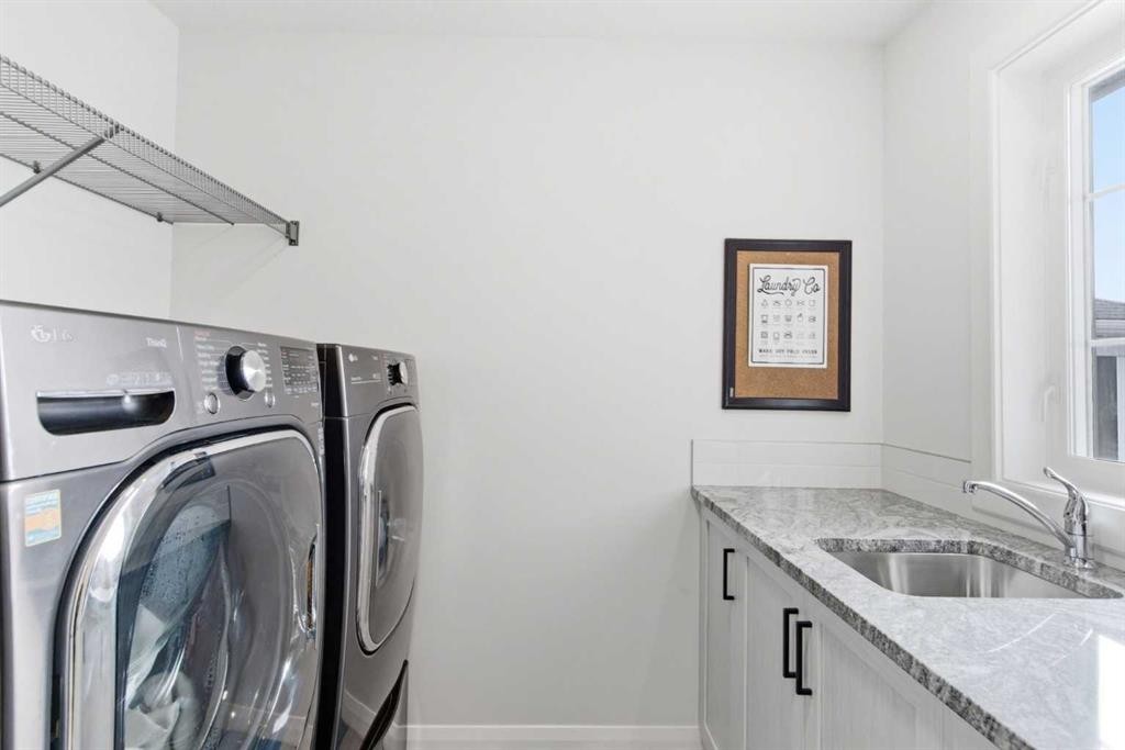 303 Rivercrest Boulevard, Cochrane, AB - Indoor Photo Showing Laundry Room
