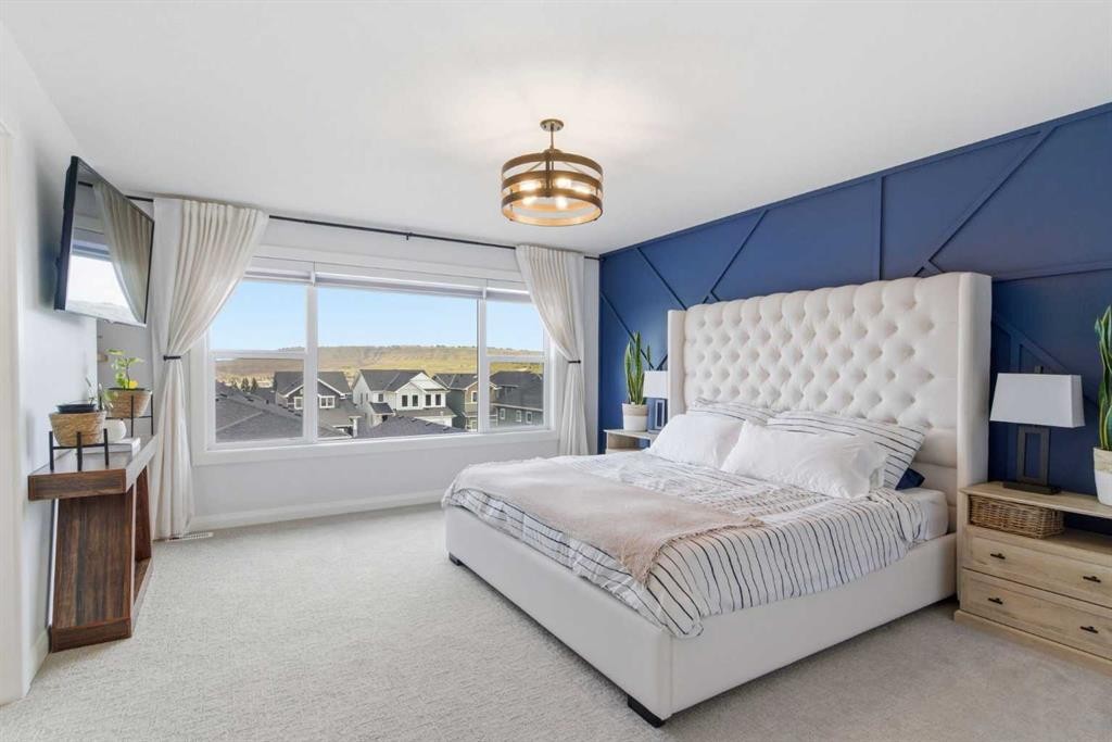 303 Rivercrest Boulevard, Cochrane, AB - Indoor Photo Showing Bedroom