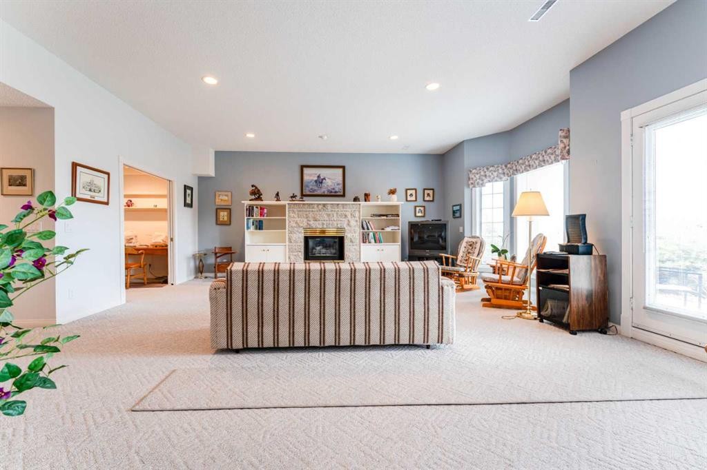8 Prominence Path Sw, Calgary, AB - Indoor With Fireplace