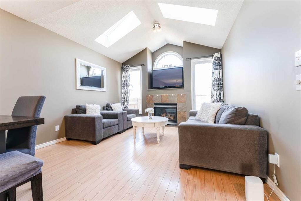 140 Prestwick Avenue Se, Calgary, AB - Indoor Photo Showing Living Room With Fireplace