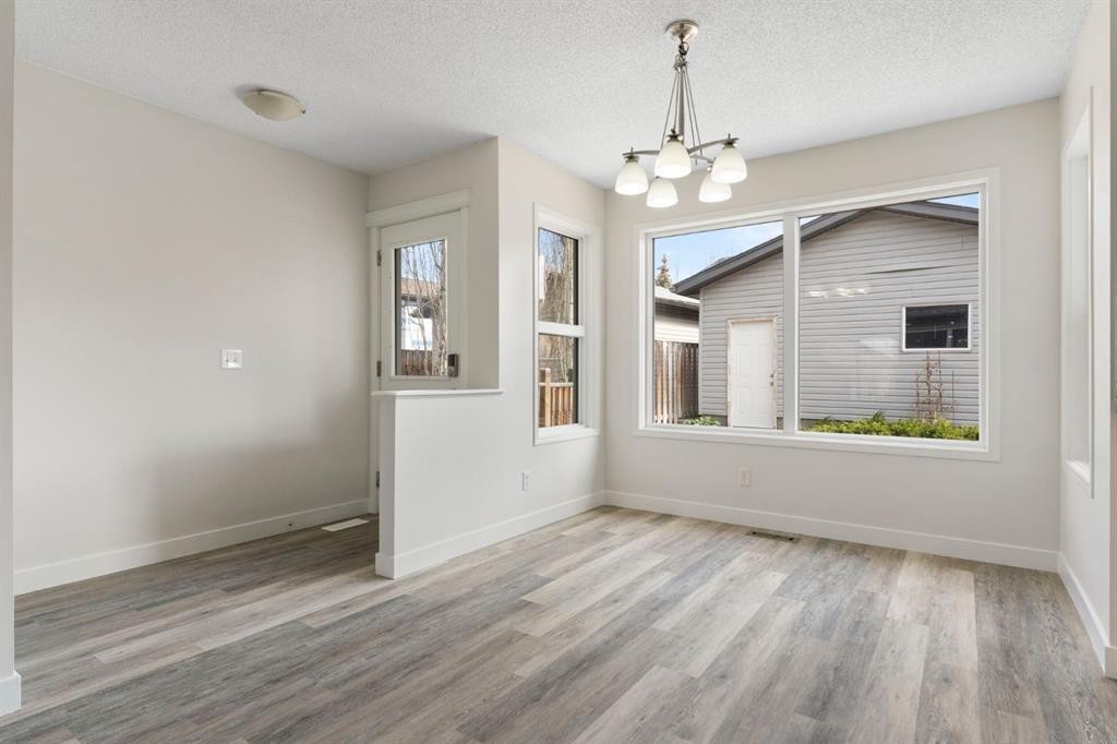 202 Sunset Heights, Cochrane, AB - Indoor Photo Showing Other Room